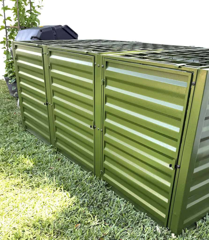 Green compost tumbler storage unit for garden composting solutions.